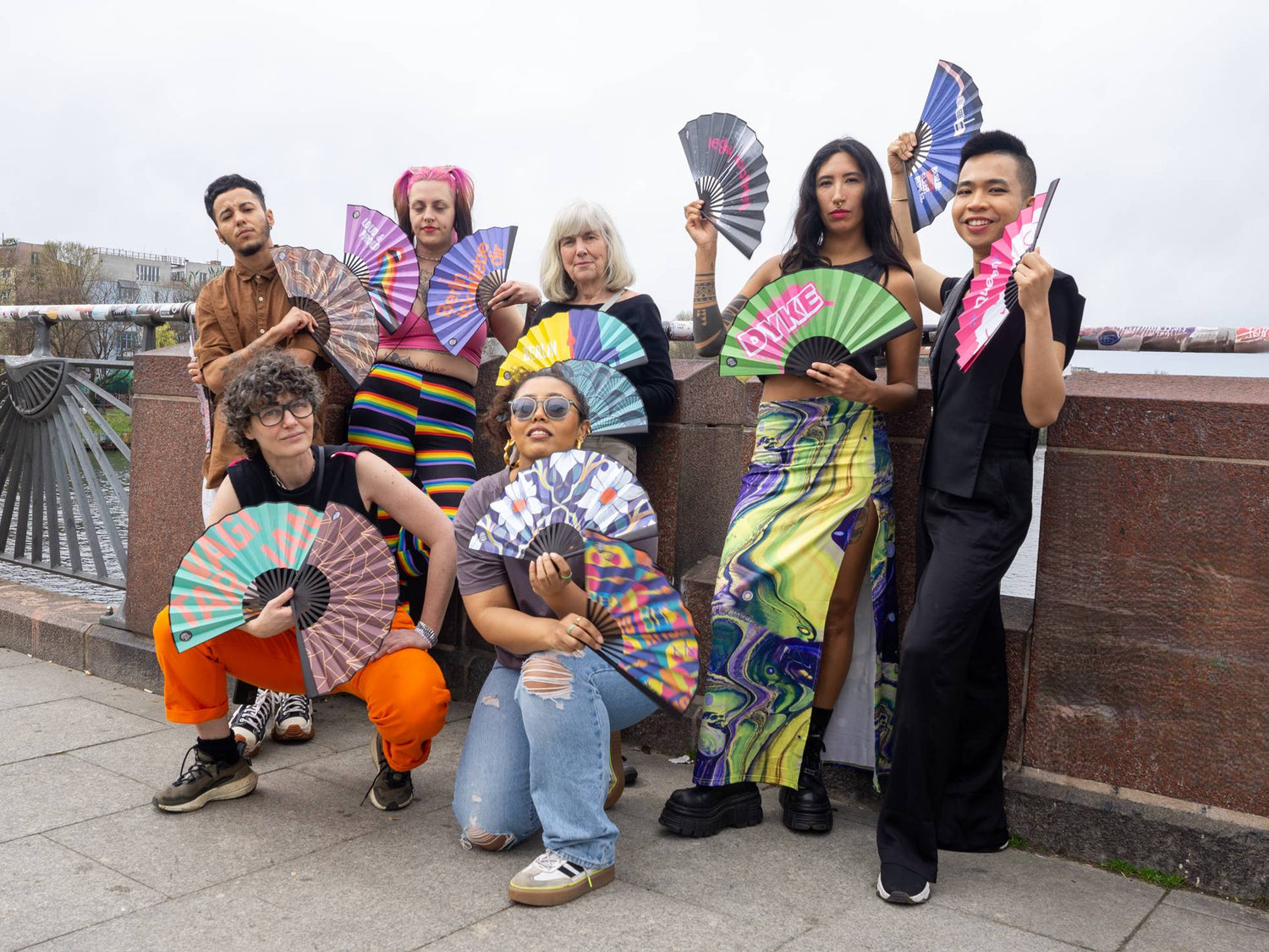 I'm a Fan! All fan designs held by seven people standing on Oberbaumbrücke Berlin.
